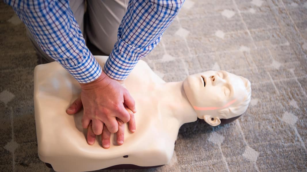 CPR training demonstration on a mannequin